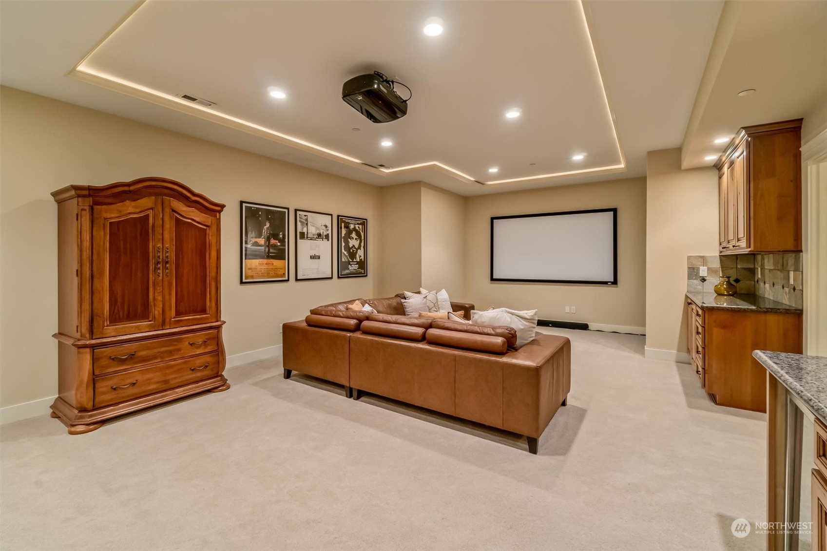 Theatre room with it's own mini bar including sink.