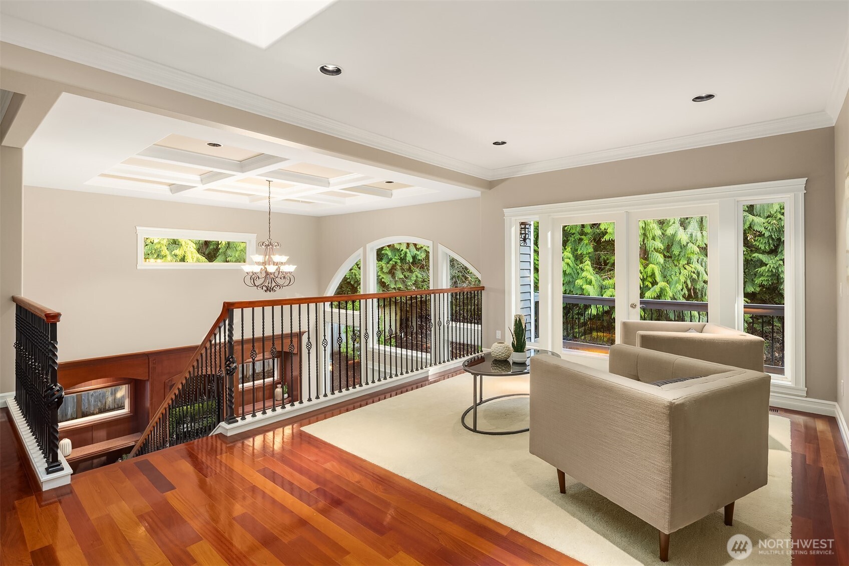 Loft area upstairs with inlaid carpet. A wonderful space to relax or play. French doors open to balcony overlooking the yard