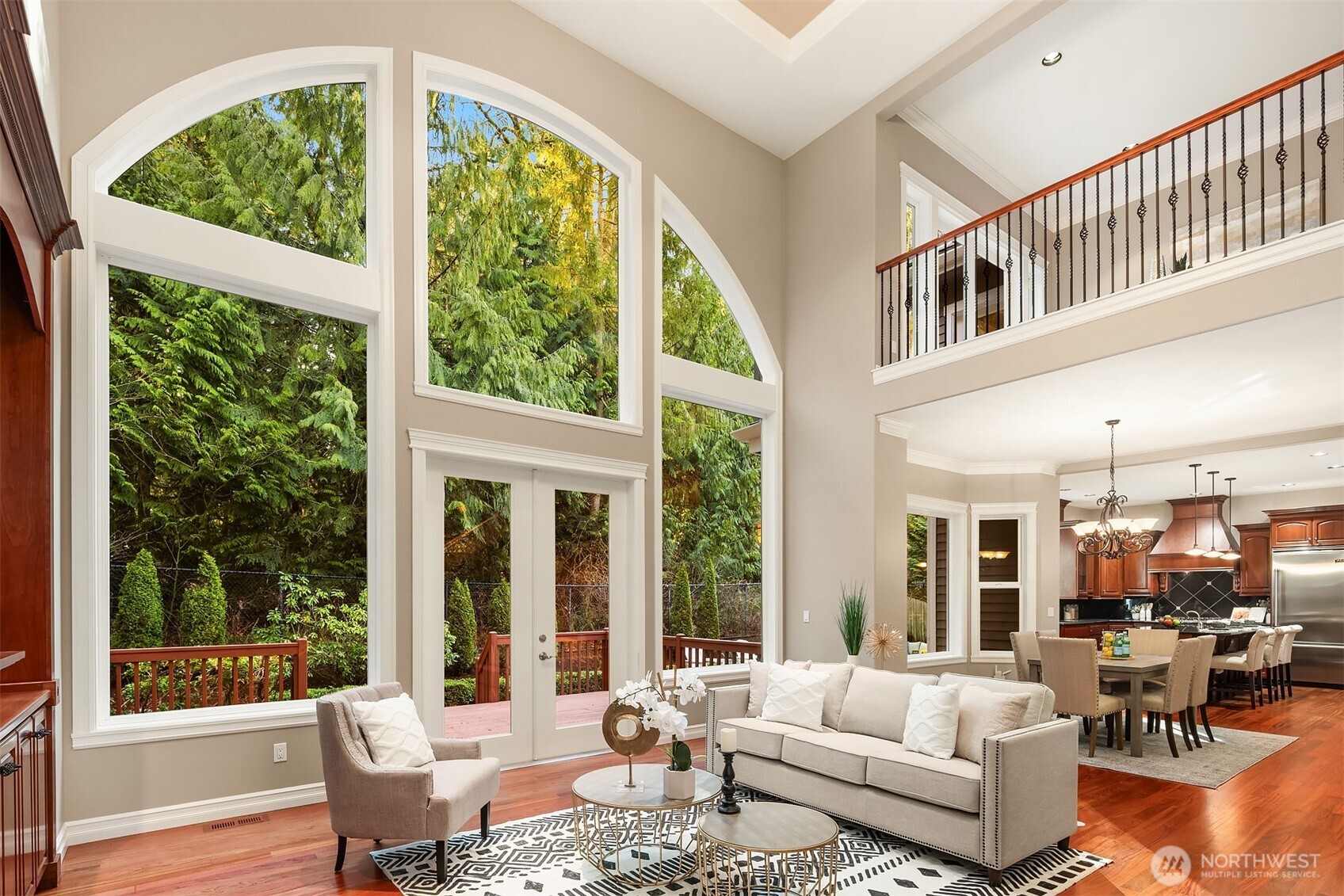 Incredible windows overlook the backyard which has both a deck and patio space - both are spacious