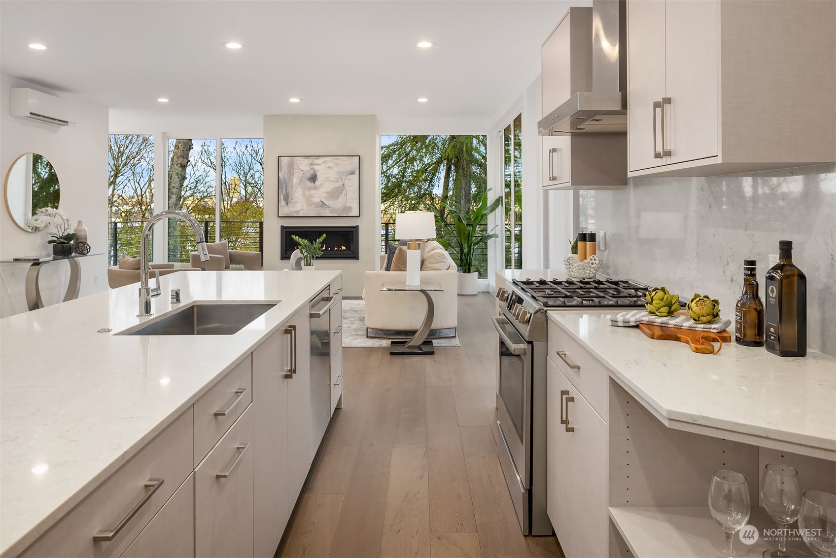 Kitchen opens to the living room + doors to main floor wrap around deck.