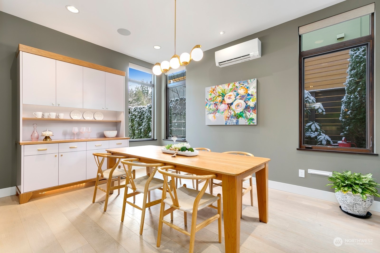 The formal dining room with custom hutch included with the home