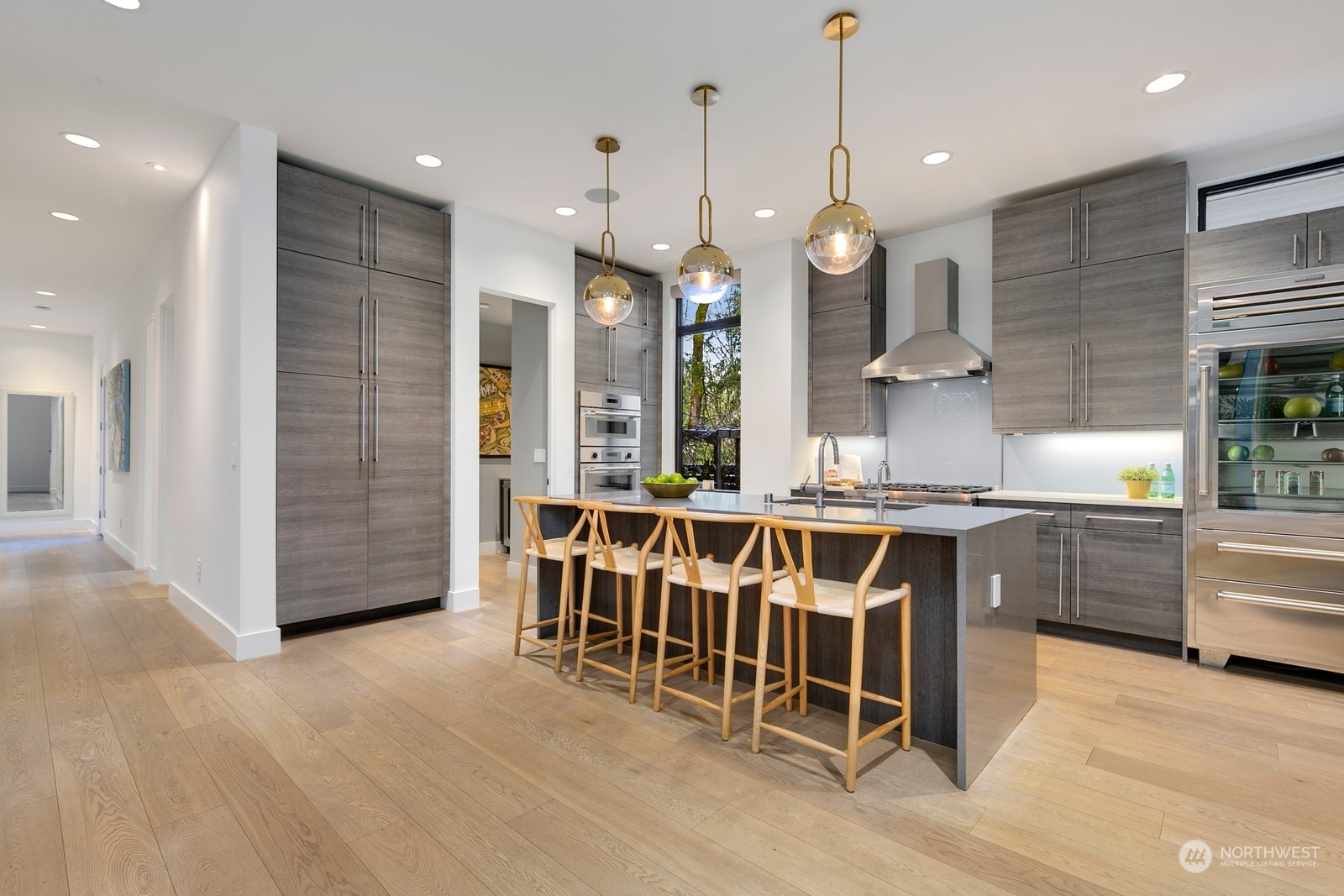 Stunning kitchen with double dishwashers, Thermador convection oven, microwave, stove, Subzero fridge