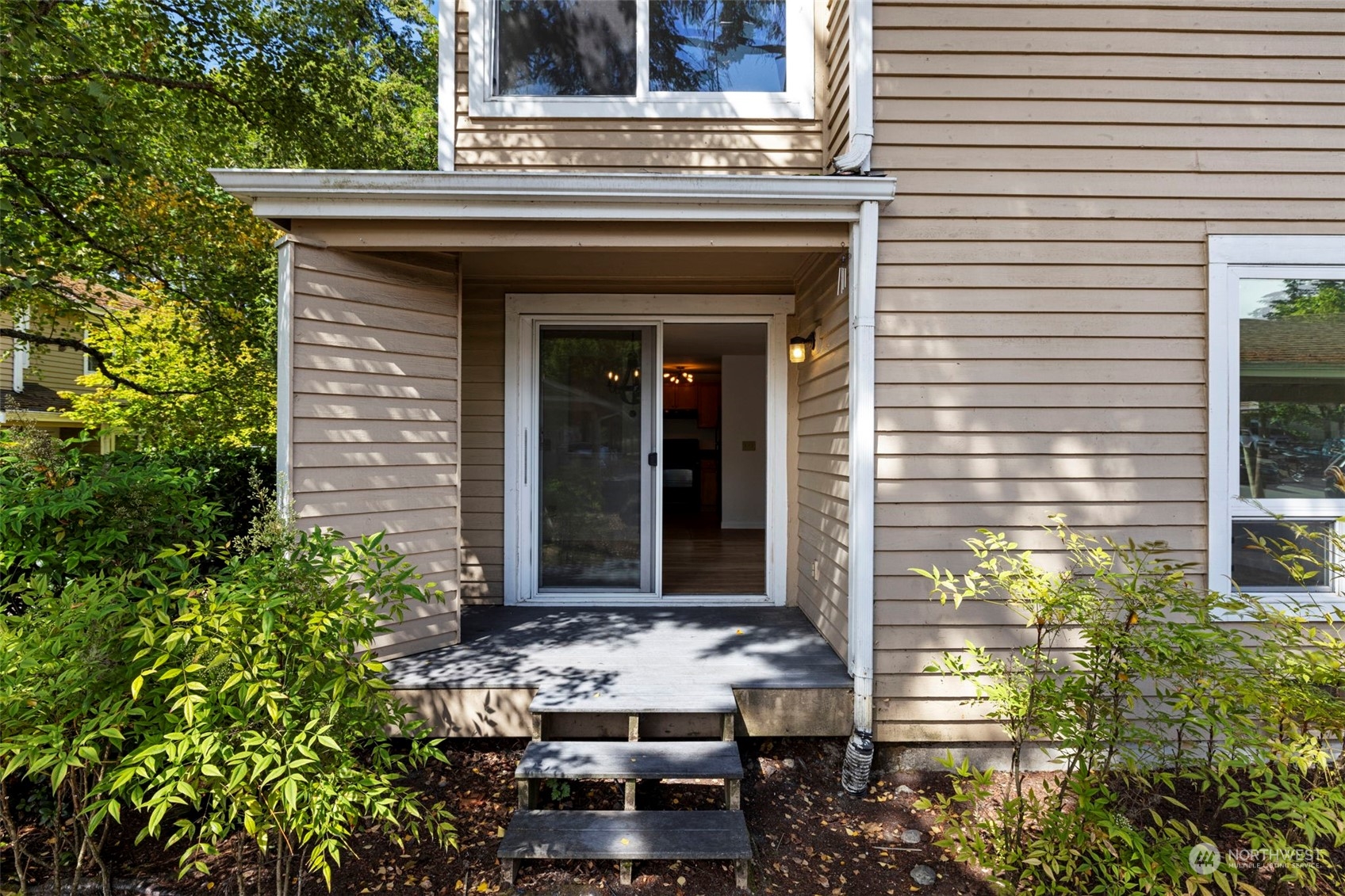 The covered patio is perfect for grilling and entertaining, with a grassy area nearby that’s ideal for relaxing or gathering with friends and family.