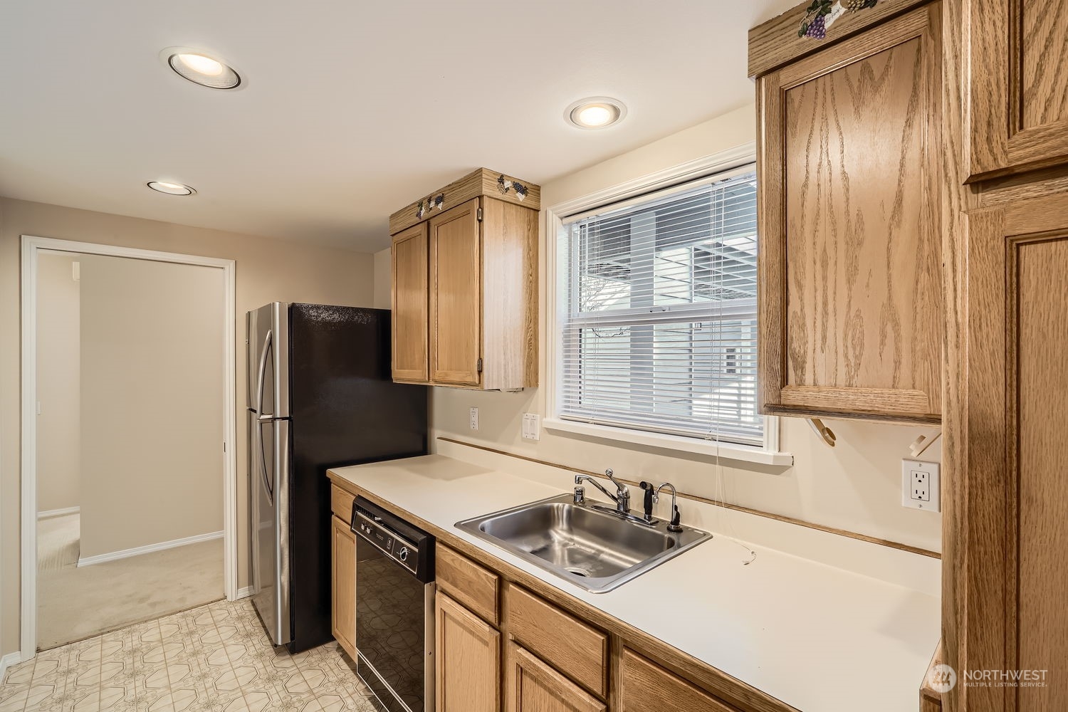 The kitchen is sparkling clean with nice views out from the kitchen window.