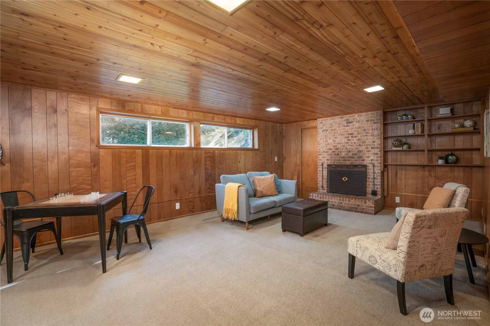 Lower level family room complete a gas fireplace and the warmth of the wood creates a cabin type vibe!