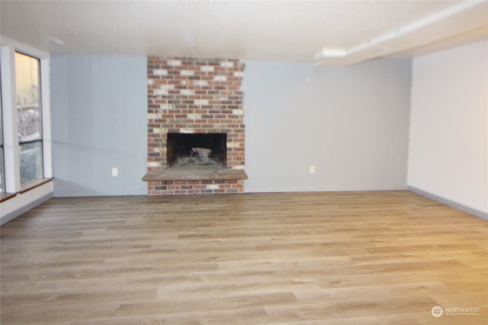 recreation room on lower level with fireplace