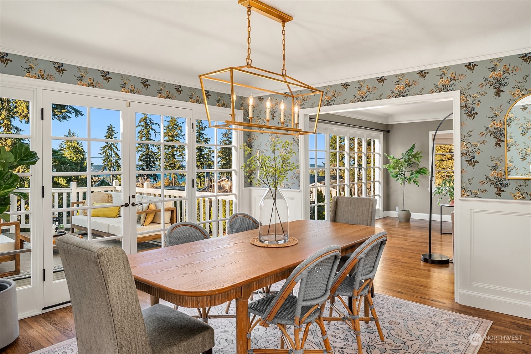 Wonderful formal dining room with darling wallpaper and   new/updated light fixtures