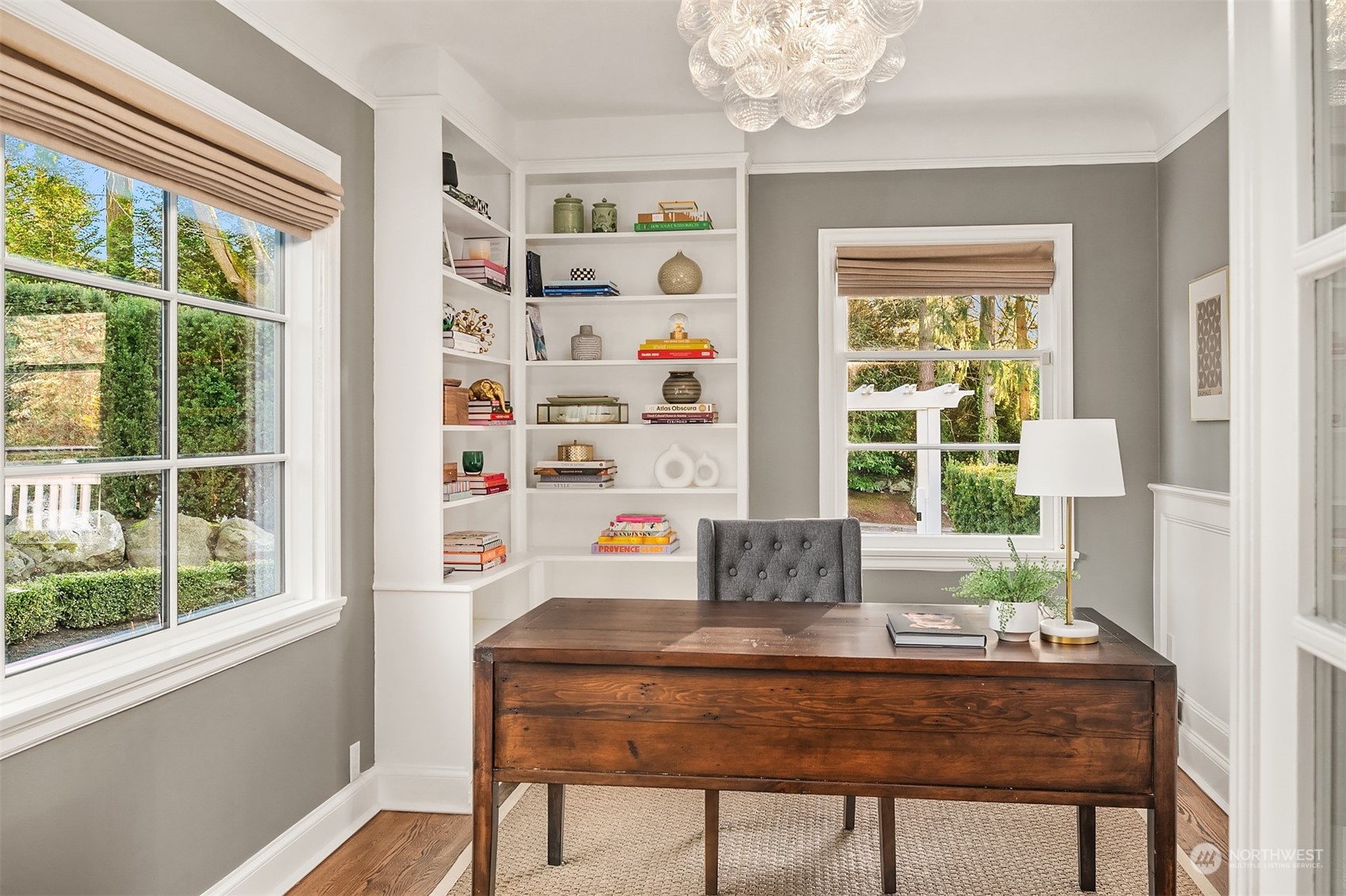 Main floor office with built-ins and such a fun glass globe chandelier