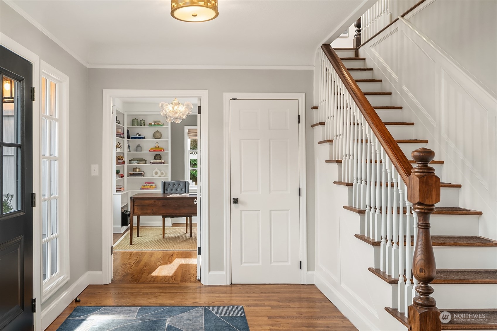 Ascend the hardwood stairs to the upper level.