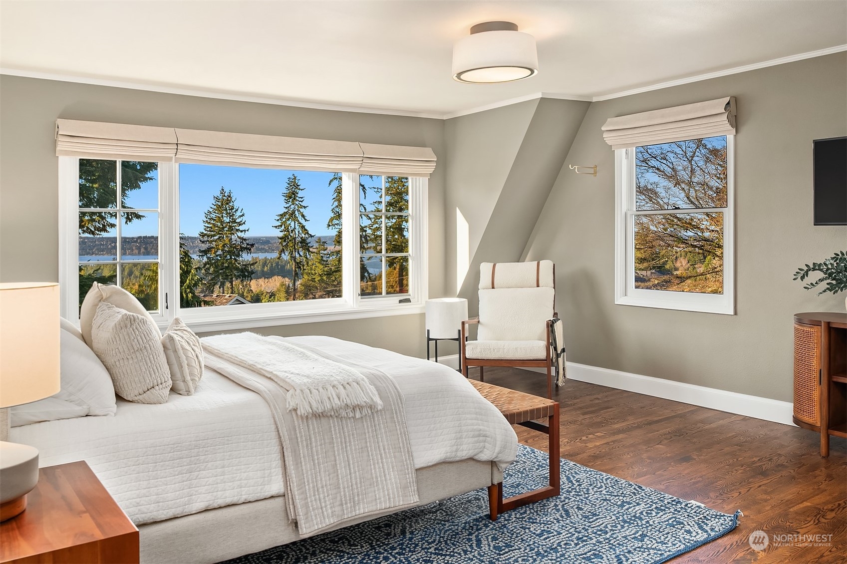 Upstairs, the primary suite is a retreat with spa-like amenities, a large picture window for breathtaking PNW sunsets.  Not shown is an oversized walk-in closet