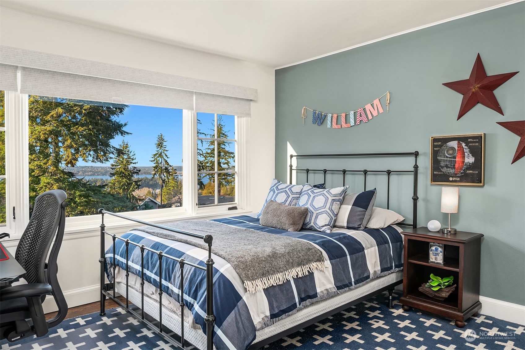 One of 3 upper level bedrooms, each with hardwood floors, custom window coverings and Westerly views.