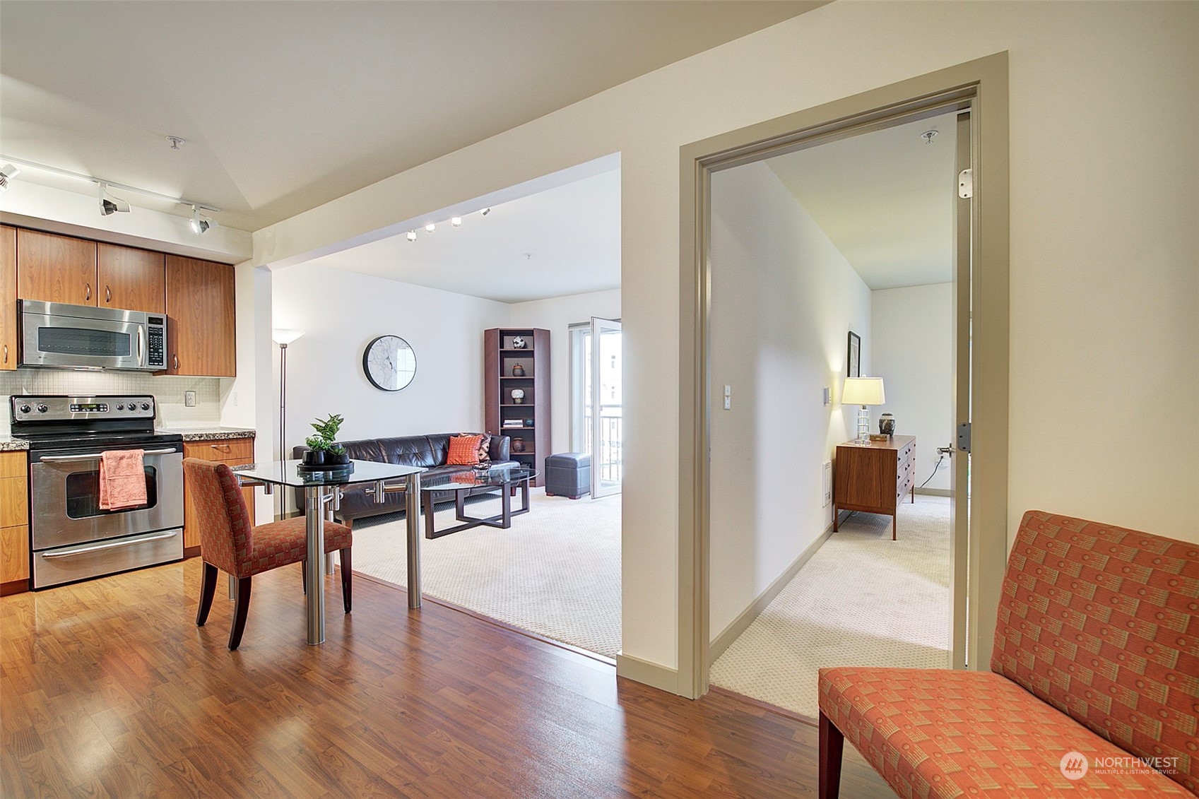 As you walk through the door of this home, you immediately notice how open and light-filled the condo is.    Its gracious floorplan maximizes comfort and functionality.