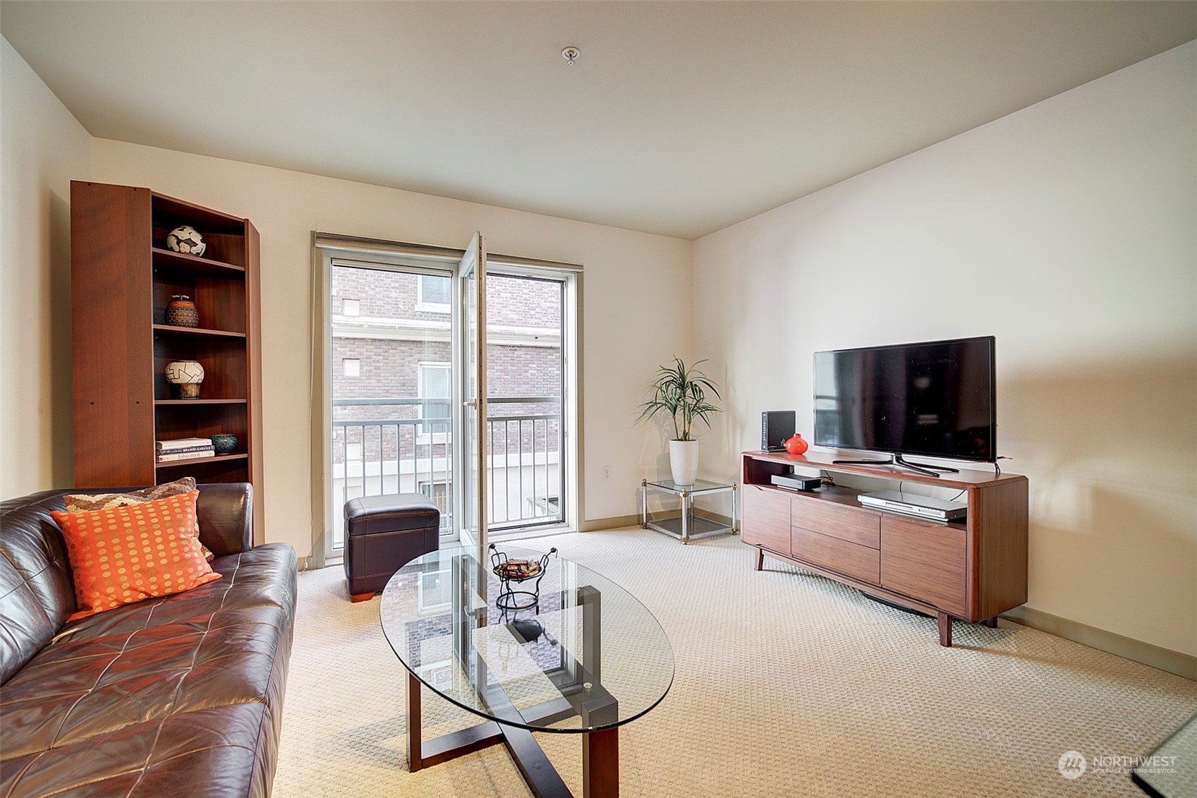 The French window in the living room opens wide like a door, or tilts inward, to welcome breezes.  The entire home is freshly painted and the carpet is brand new.