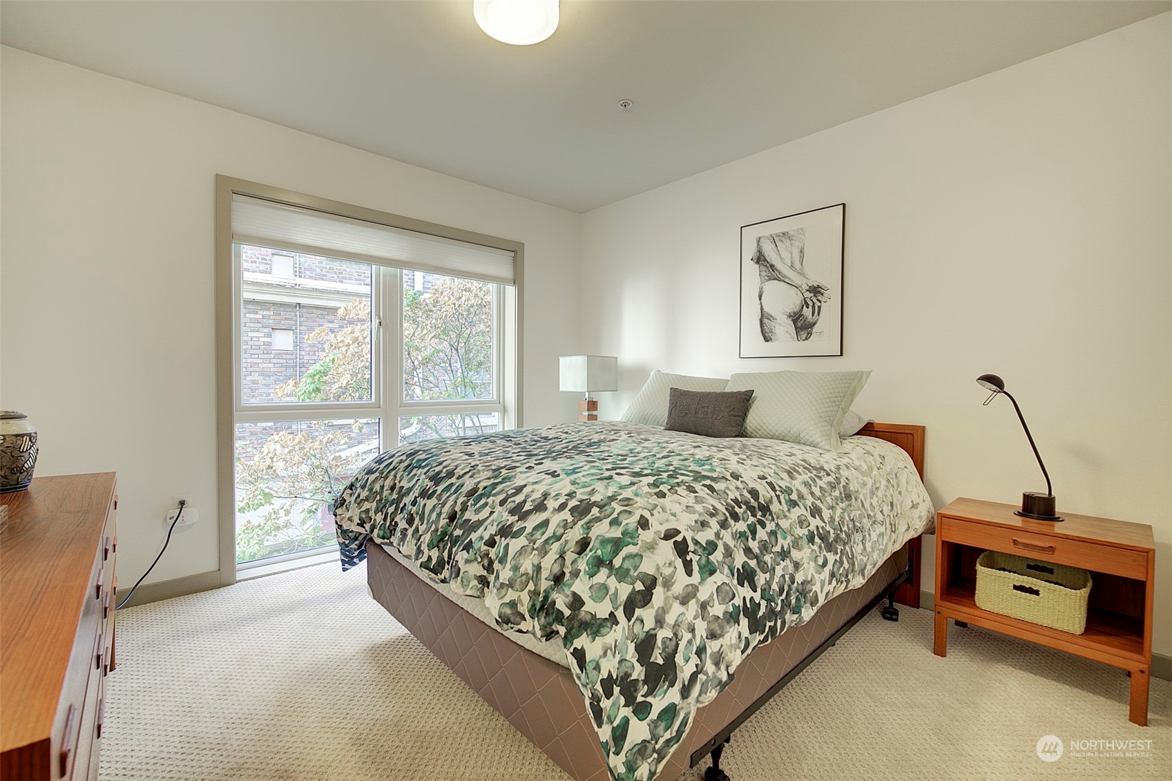 Here's where this home's quiet location in the building pays off.....a bedroom with no street noise, no traffic, just peace & quiet.