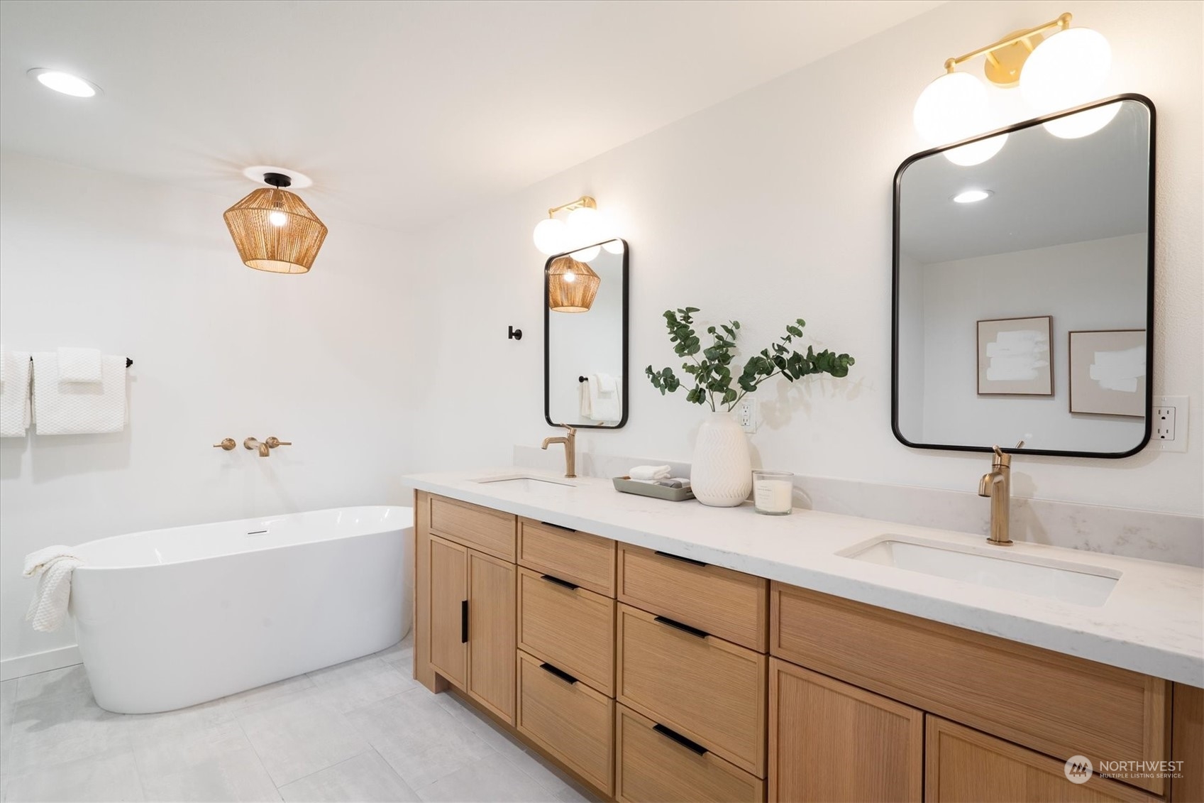 Spa-like primary bathroom with double sinks and ample storage