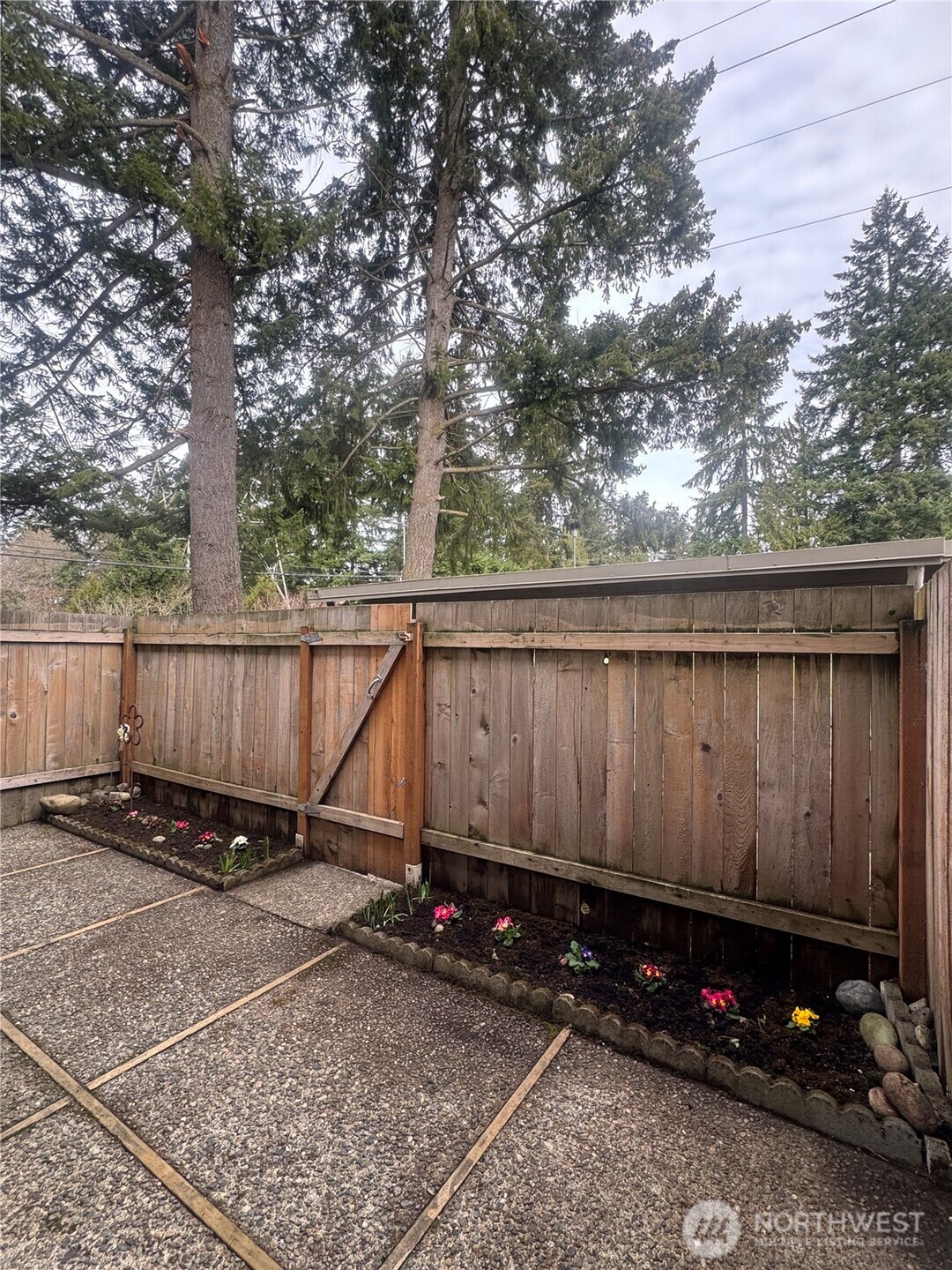 Al fresco dining in the backyard. Newer fence.