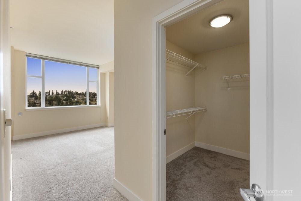 Main bedroom with view of downtown Seattle and mountains on a clear day