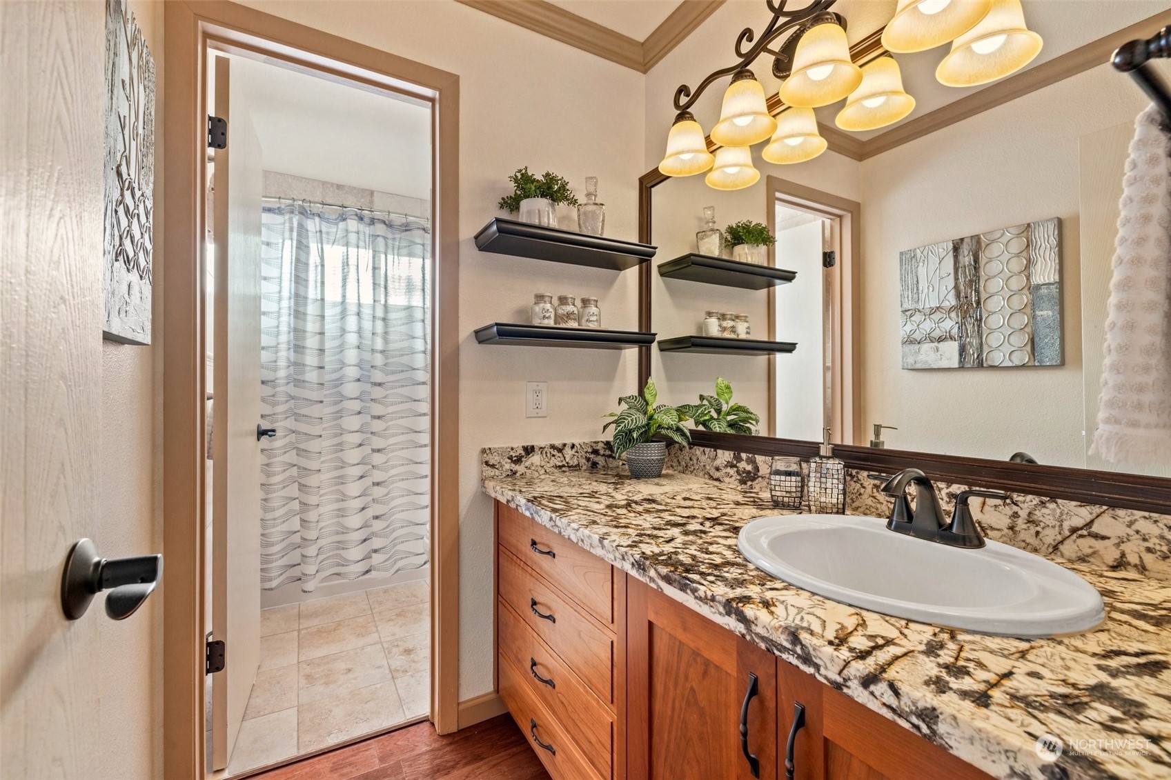 Guest bathroom with custom cabinetry, granite countertops and engineered hardwood flooring.