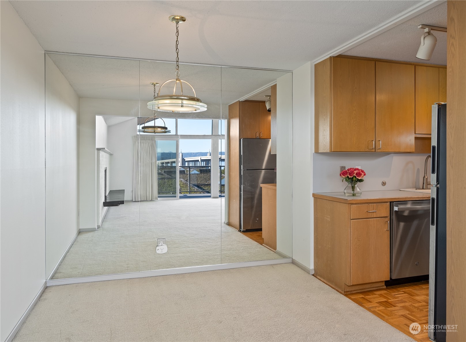 Mirrored wall in dining area off kitchen