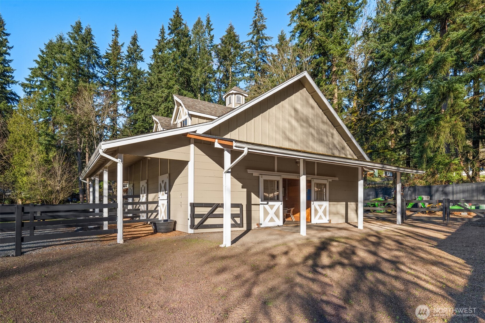 Additional large gravel paddock featuring Hoofgrid footing and additional shelter.  Plenty of equipment storage makes this equestrian property ideal for easy maintenance.