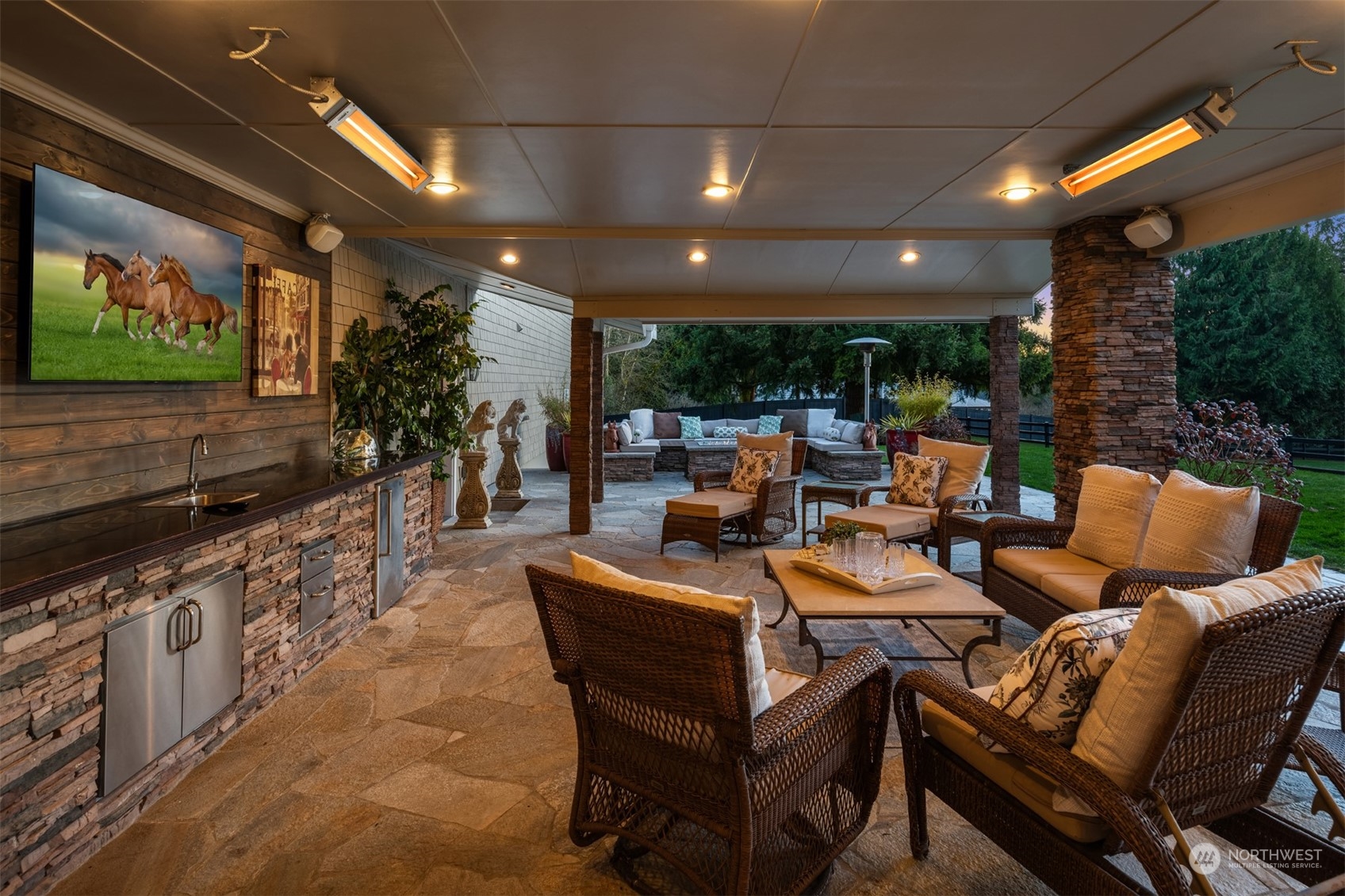 Heated and covered. Seamless indoor-outdoor living with Nano doors and fully equipped outdoor kitchen.