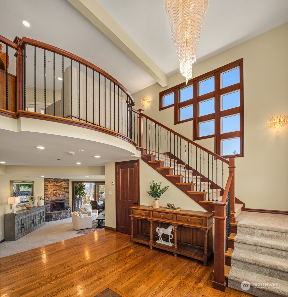 Grand entrance featuring dramatic self-lowering chandelier and updated interiors.