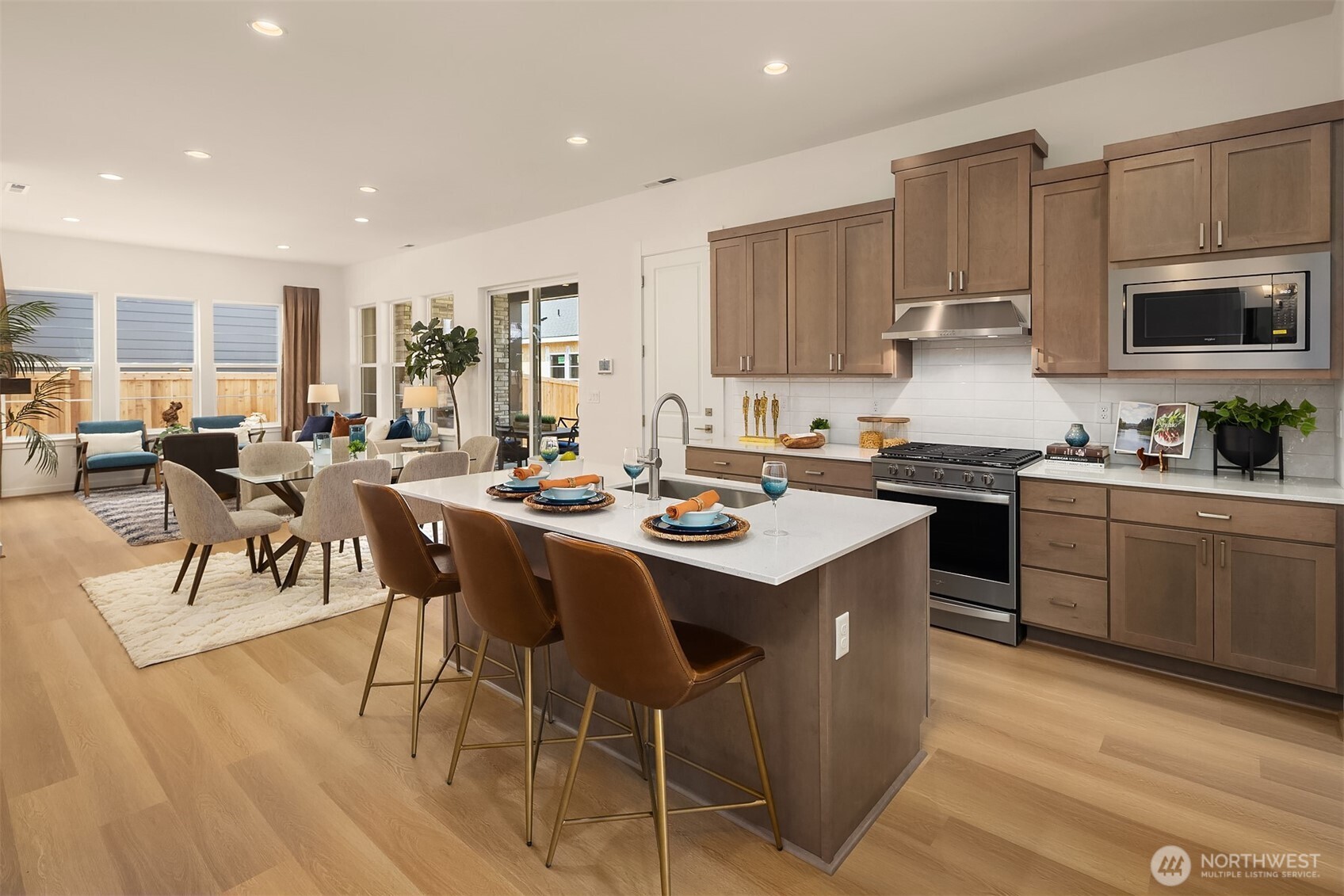 Ktichen, dining and great room. *photo taken from another similar staged home*