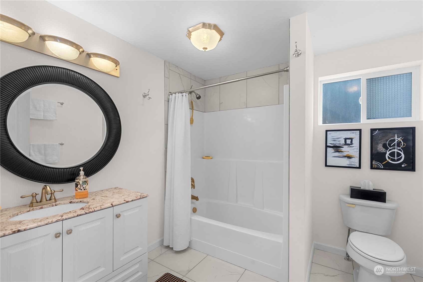 This full bath is located next to one of the lower level bedrooms.