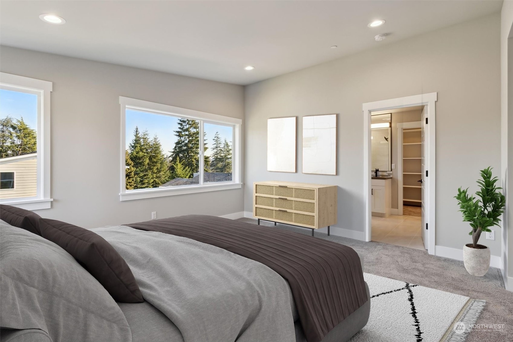 larg windows and vaulted ceilings make the primary Bdrm light & bright