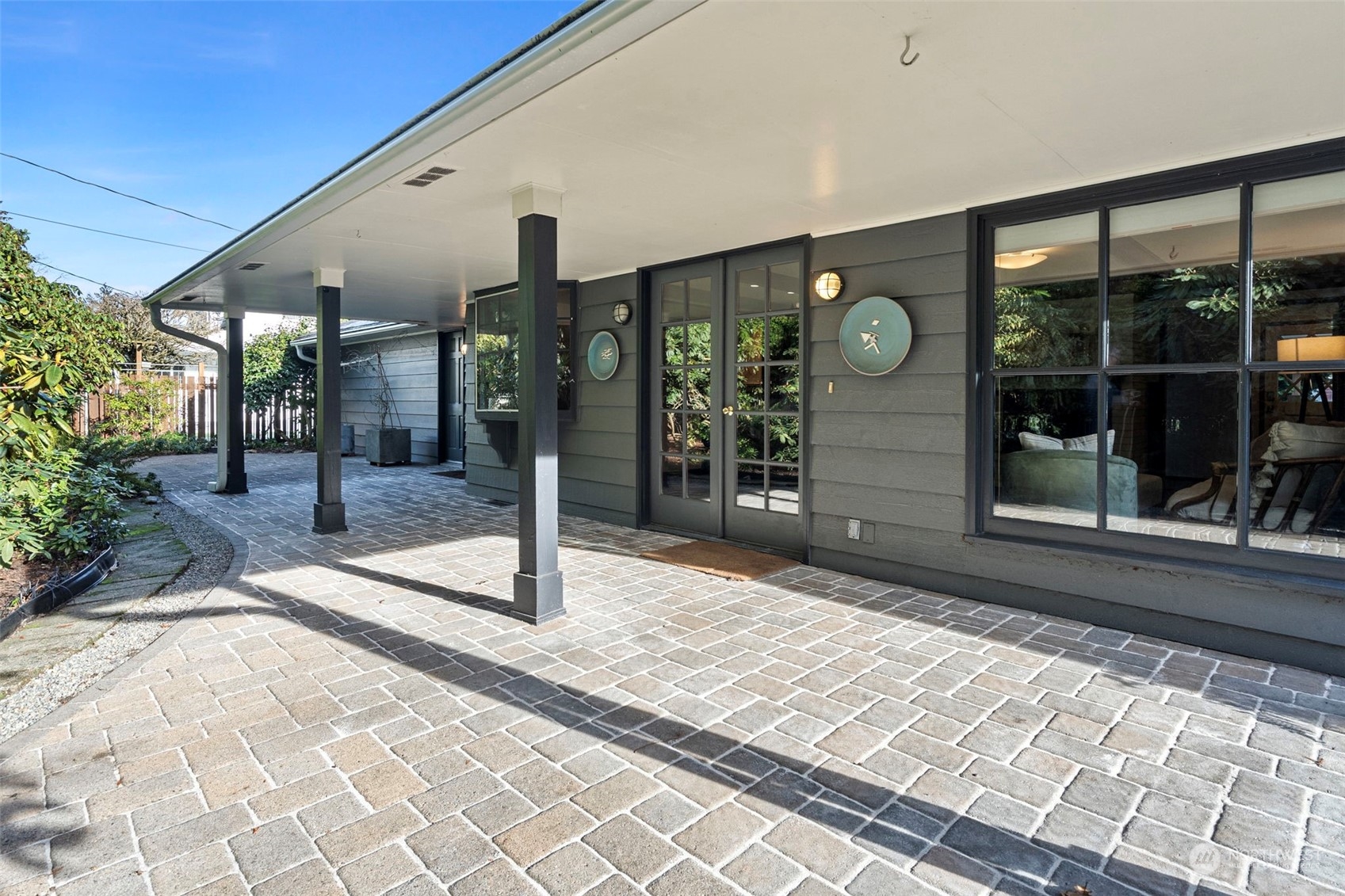 Partially covered patio off the family room is ideal for entertaining