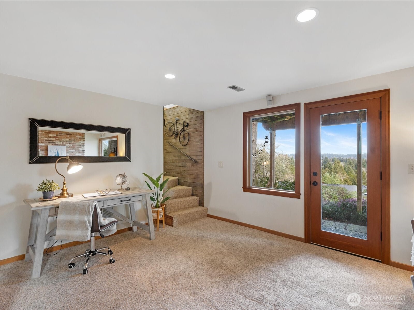 Downstairs living space has new carpeting and access to backyard.