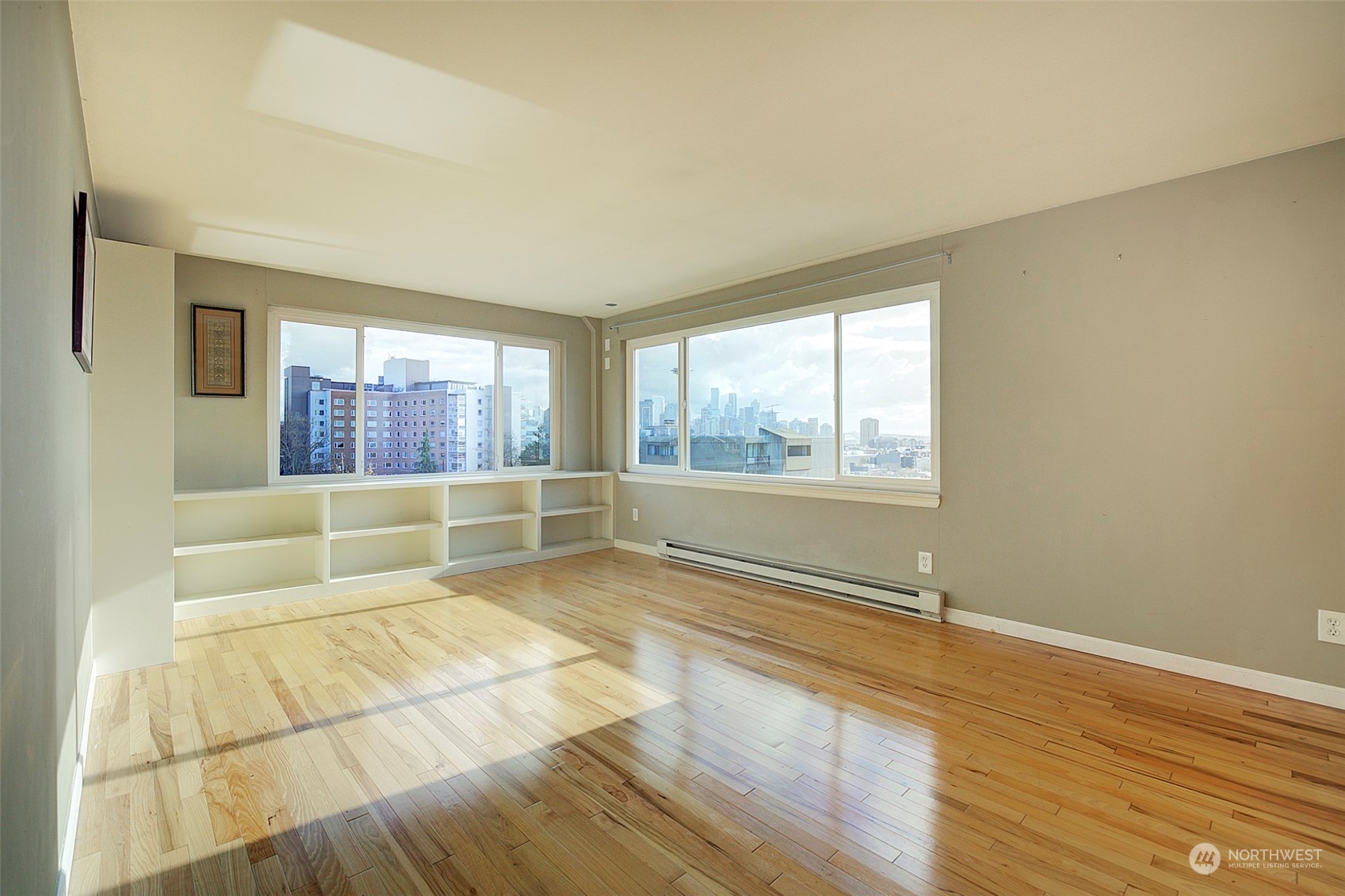 Spacious living room with built in shelves.