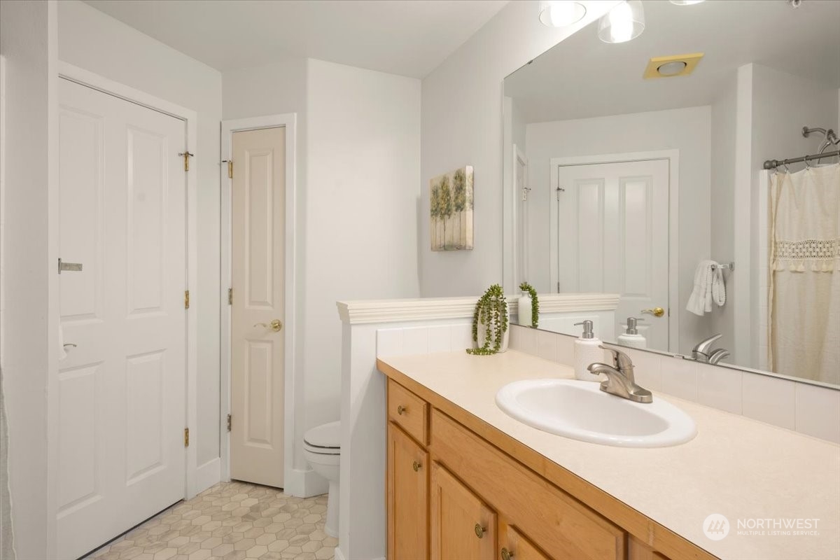 The main bath has a tub/shower combo plus a linen closet for extra storage.