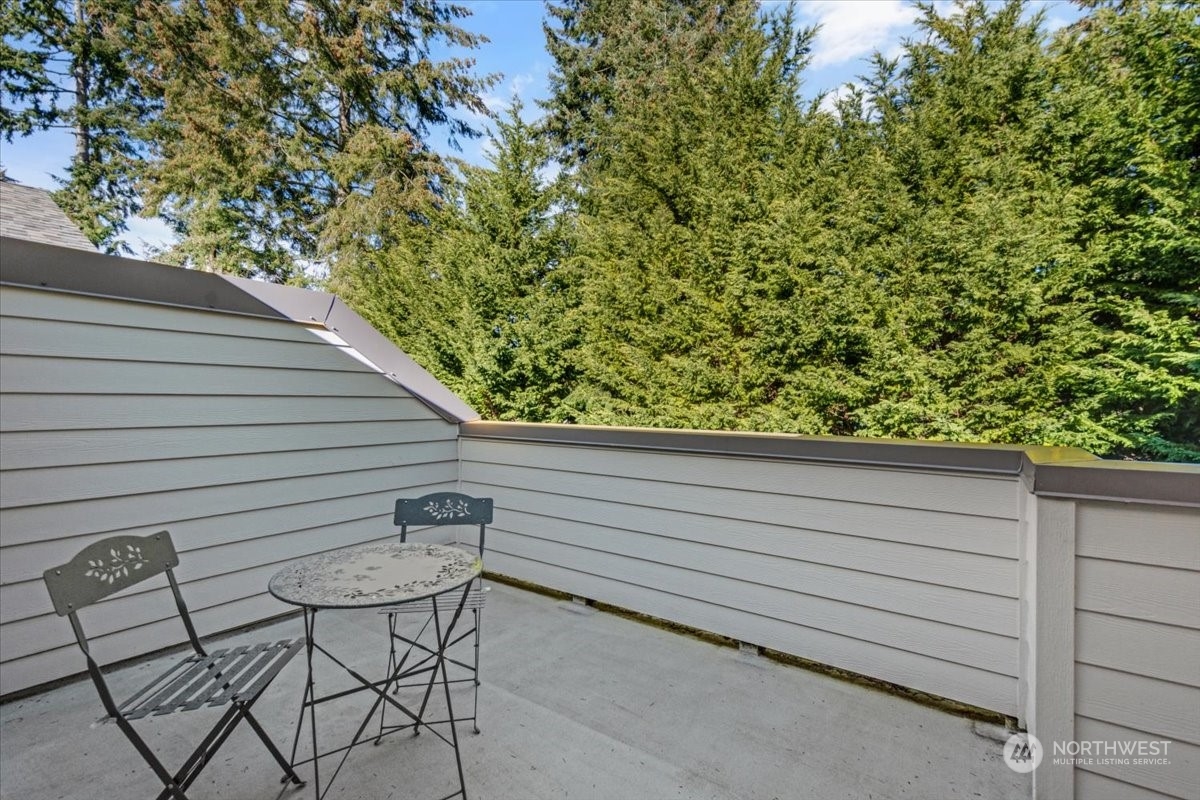 Deck off the living room has lots of privacy and surrounded by beautiful trees.