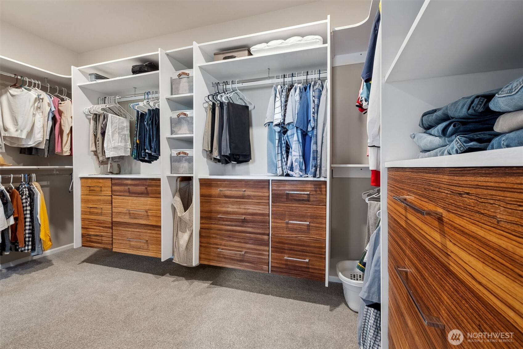 Fantastic walk-in-closet includes built ins and beautiful custom made drawers, built by the owner!