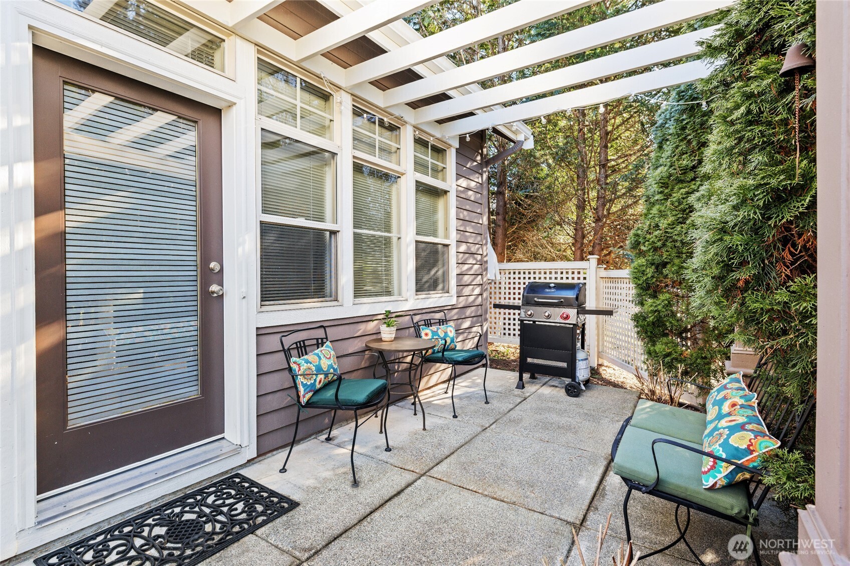 Spacious patio looks out to the peaceful green space