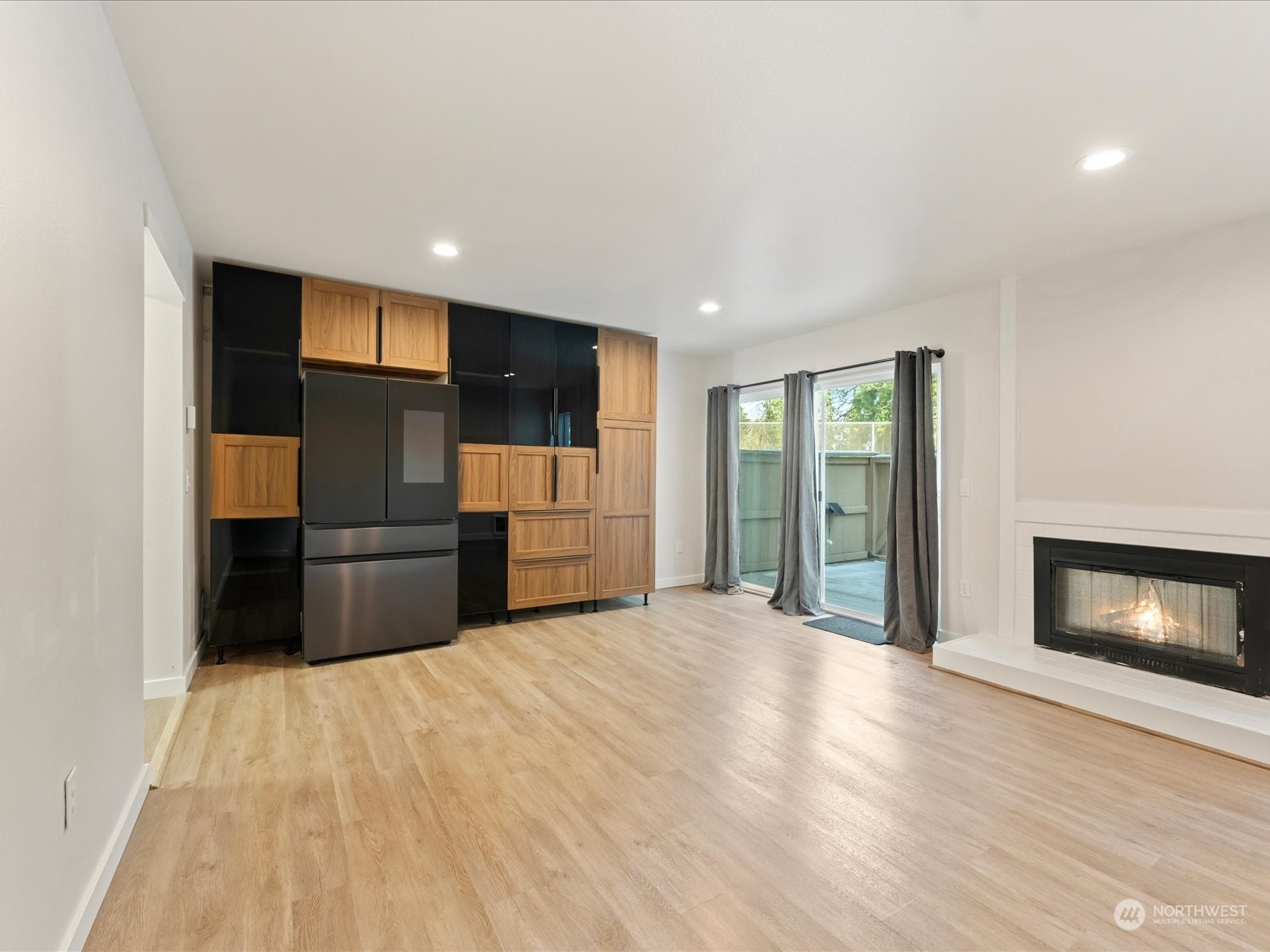 Family room w-wood fireplace & slider to private trex deck