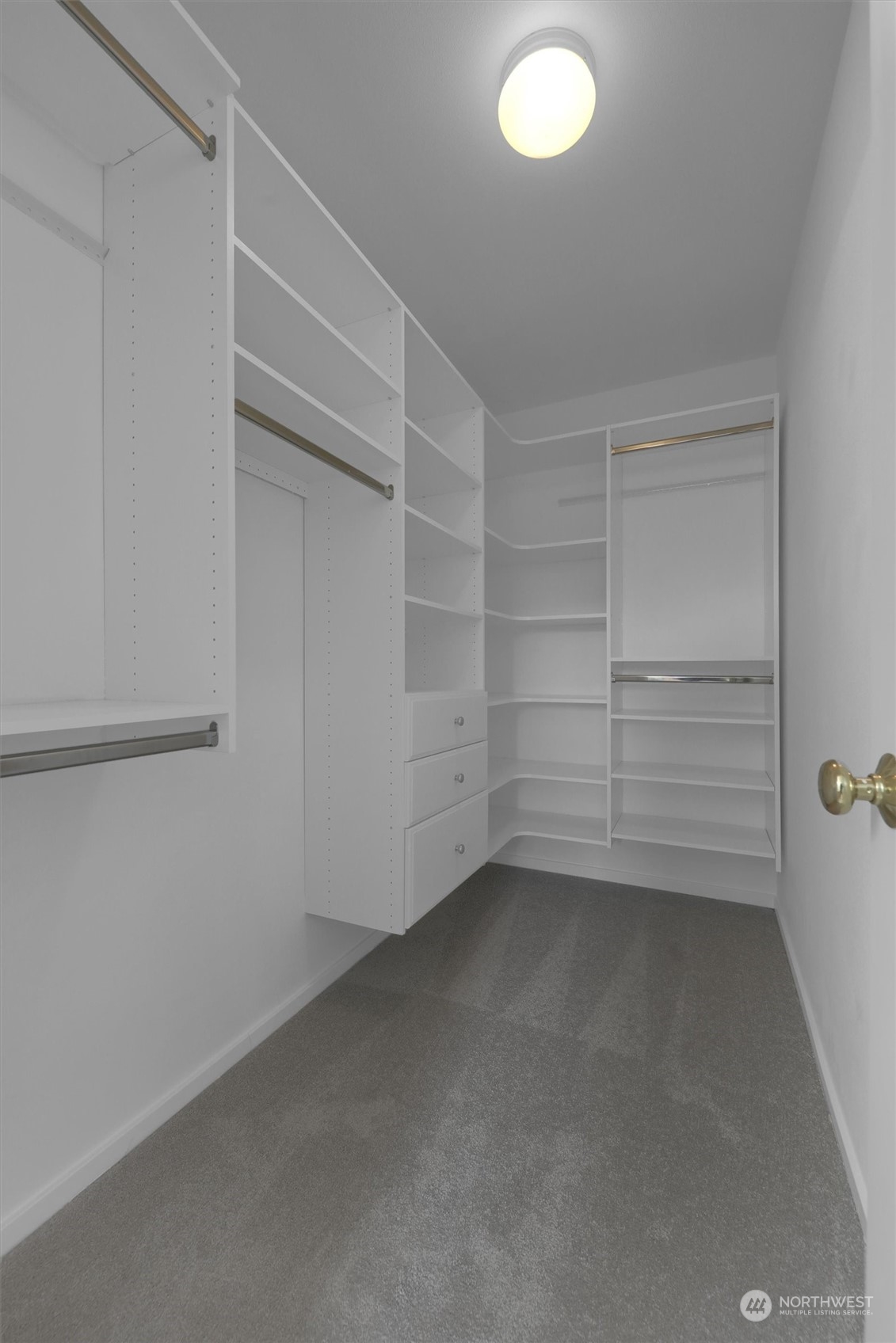 Walk-in closet with custom cabinets