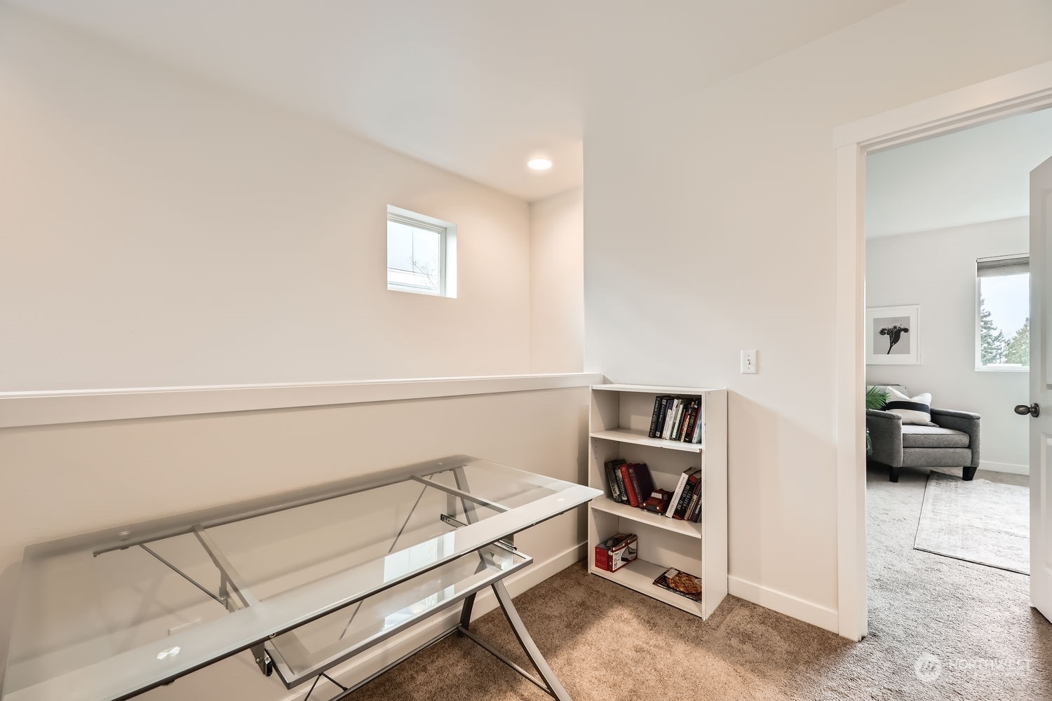 The walk-in laundry room has full-size appliances and excellent storage