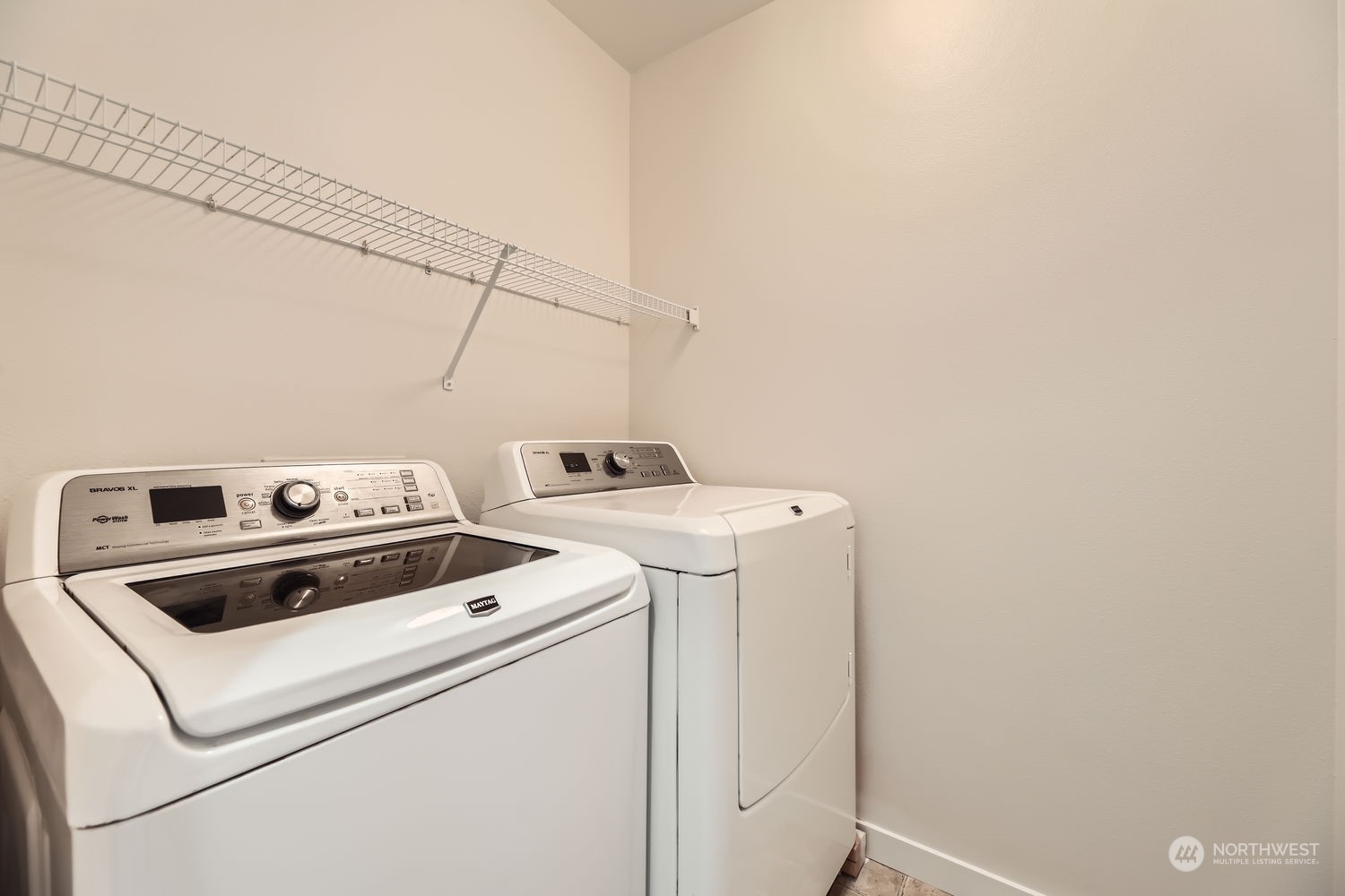 The main floor entry foyer features a half bath and large coat closet. Bonus storage under the stairs is great for bulky items