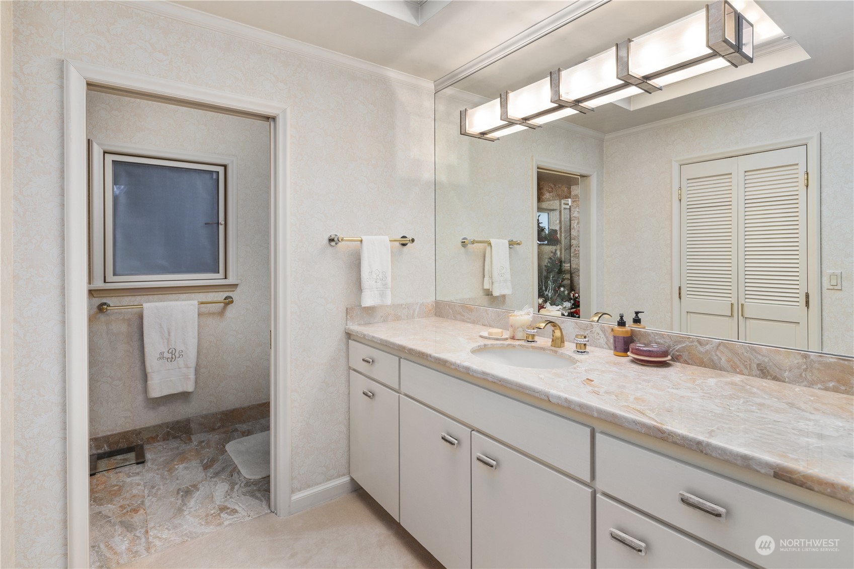 Primary bathroom has large tub and a bathroom on each side (separate sinks, showers, and toilets).