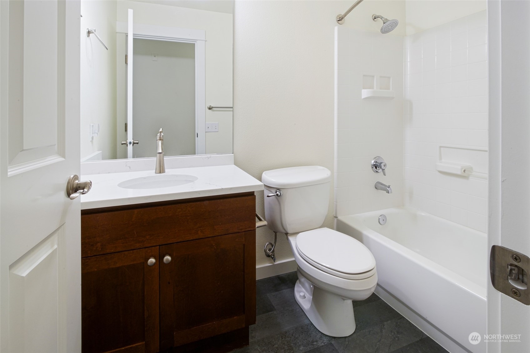 Hall bath with new quarts slab counters.