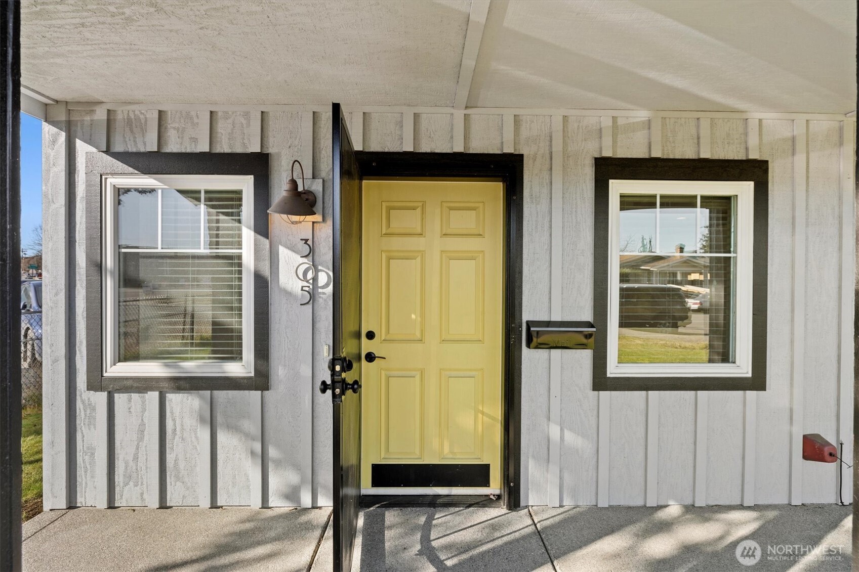 Locking metal screen door on the front.