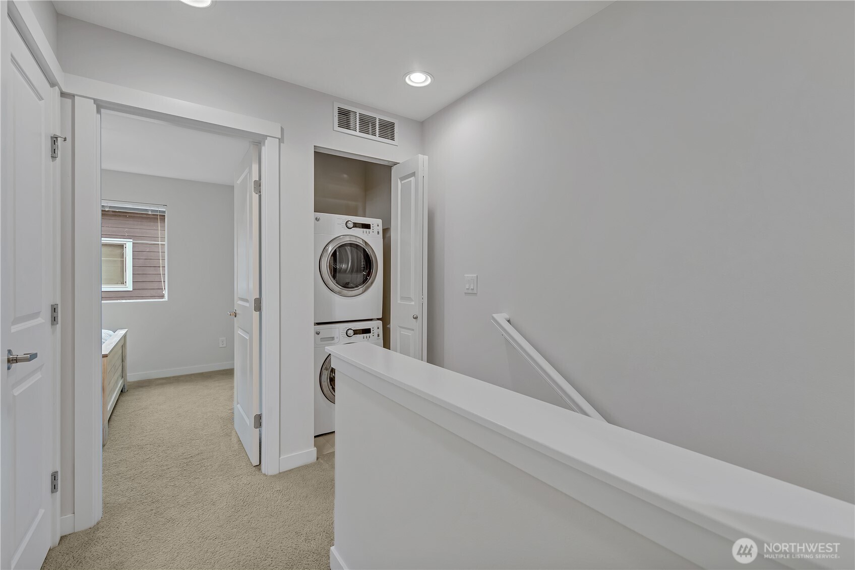 Upper landing with a convenient stacking washer and dryer.