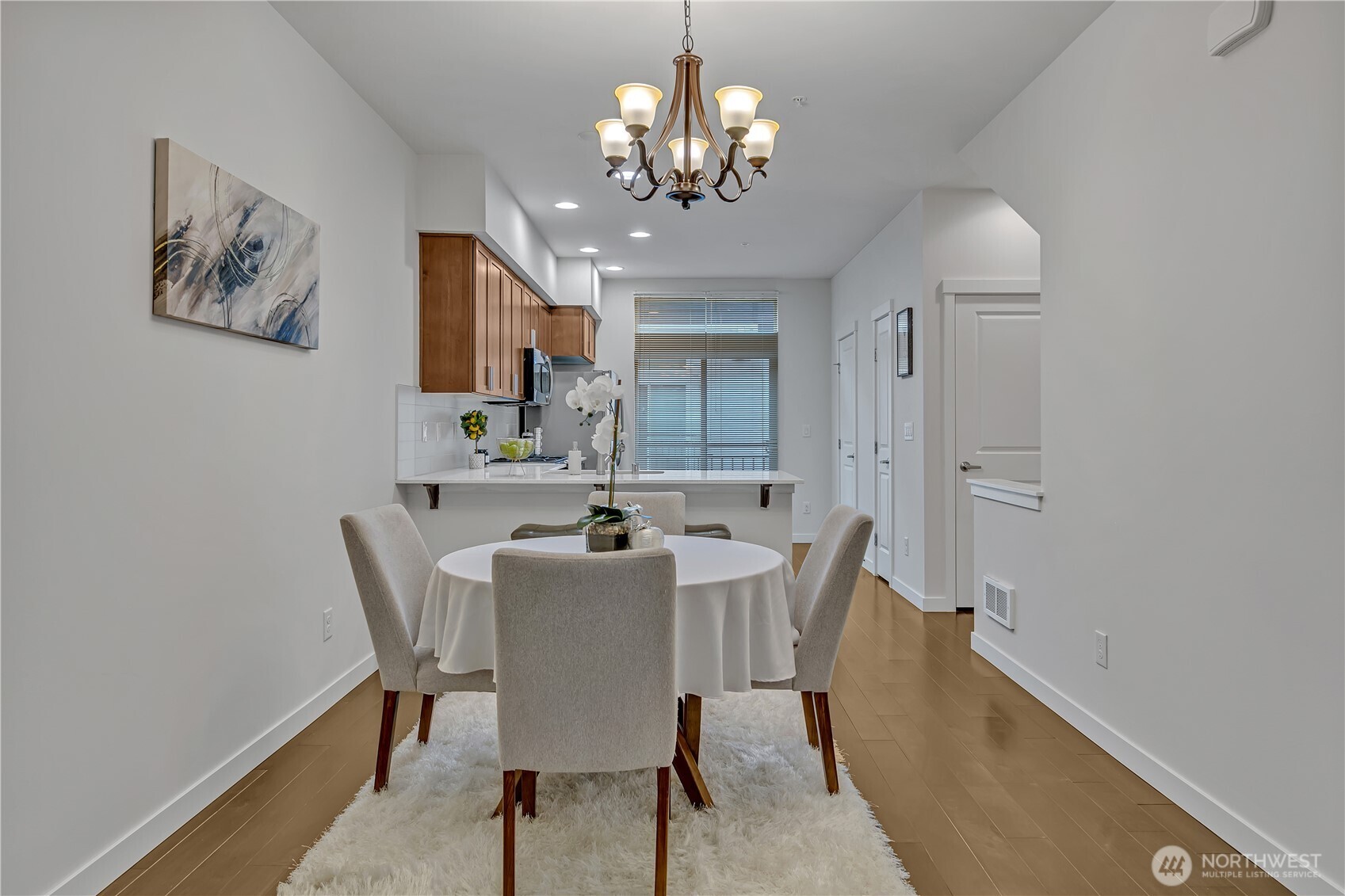 The dining room is open to both the kitchen and the living room.