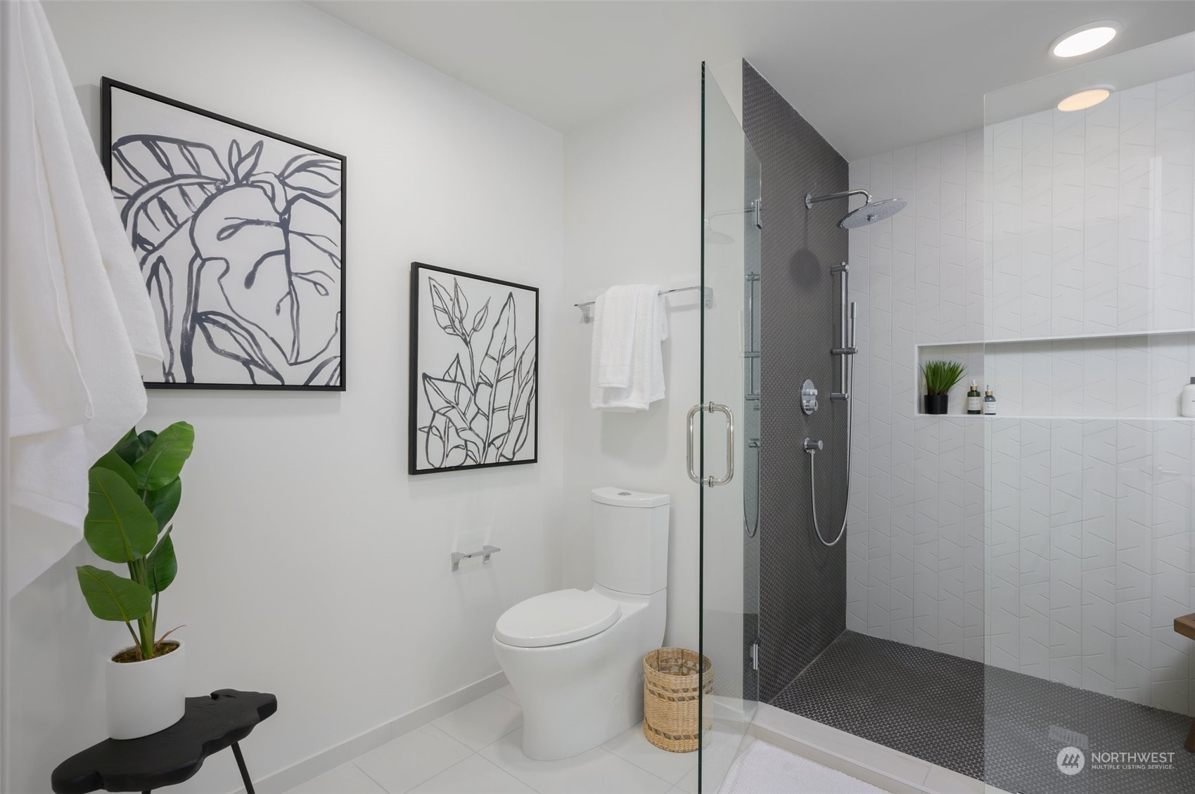 Bathroom features a ceramic tile walk-in shower and a floating quartz vanity with a daylight mirror.