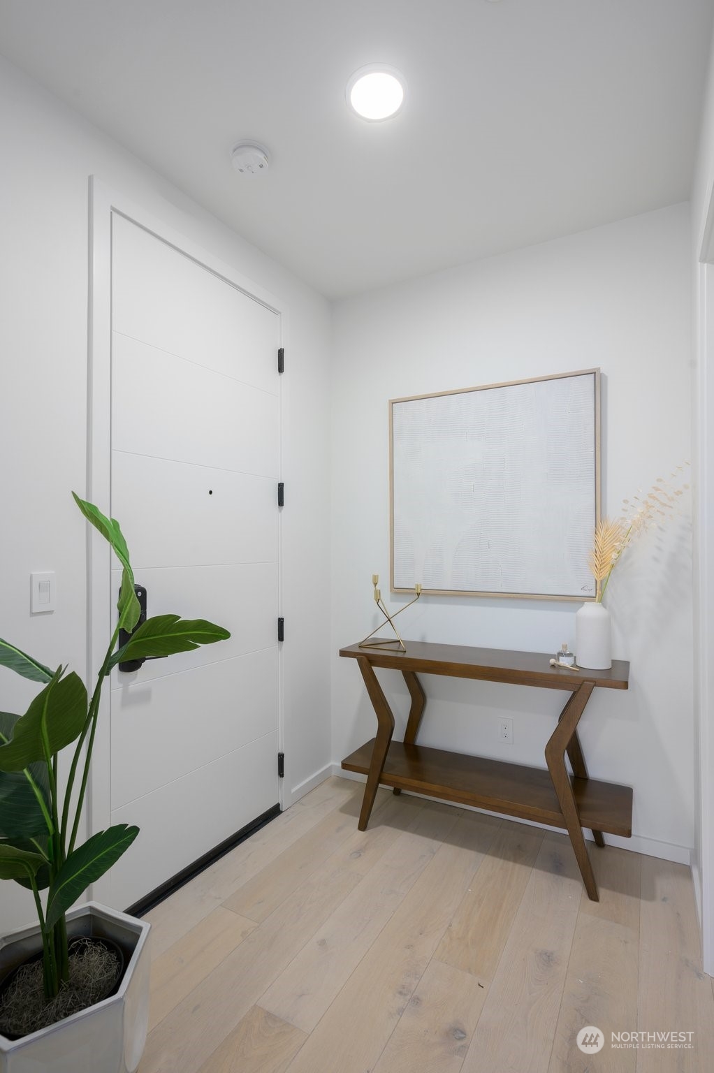 Adjacent to the entry way is an oversized storage closet/utility room.