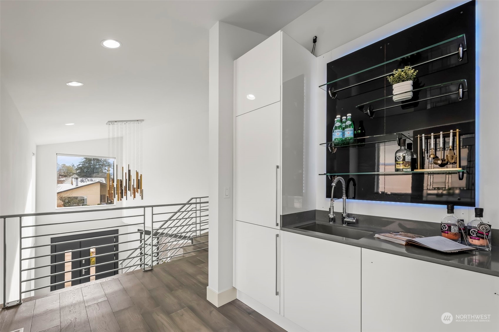 Full wet bar with integrated fridge & freezer by access to rooftop deck.