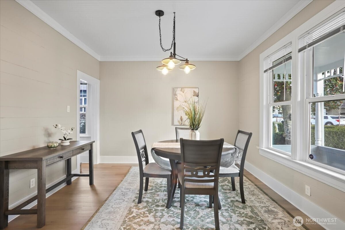 Terrific view of formal dining room. Crown molding, new laminate flooring!