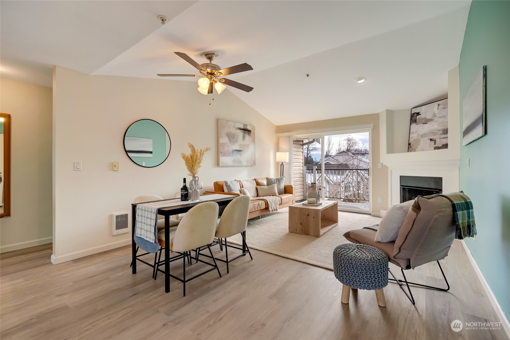 Greeted by vaulted ceilings & New Lifeproof LVP flooring in the kitchen, living, and hallway